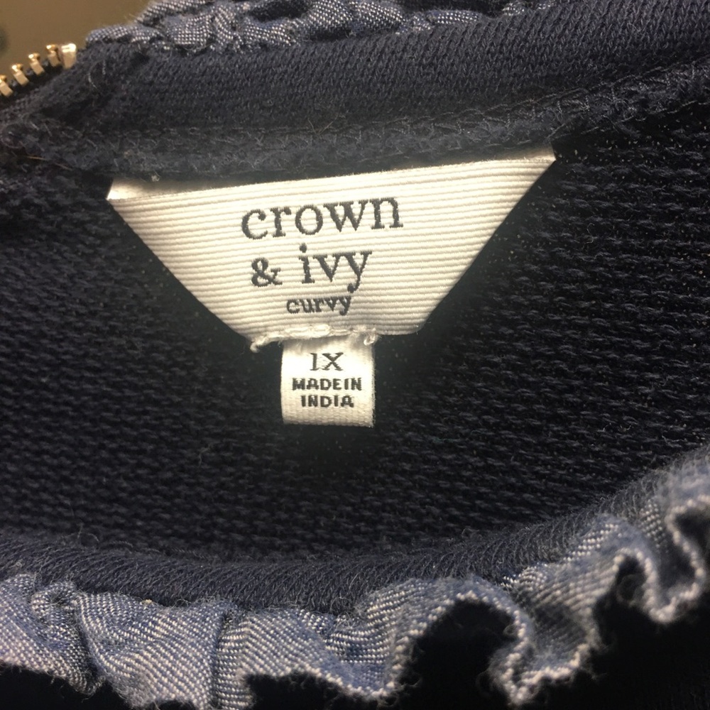 Jeweled crown and ivy sweater.